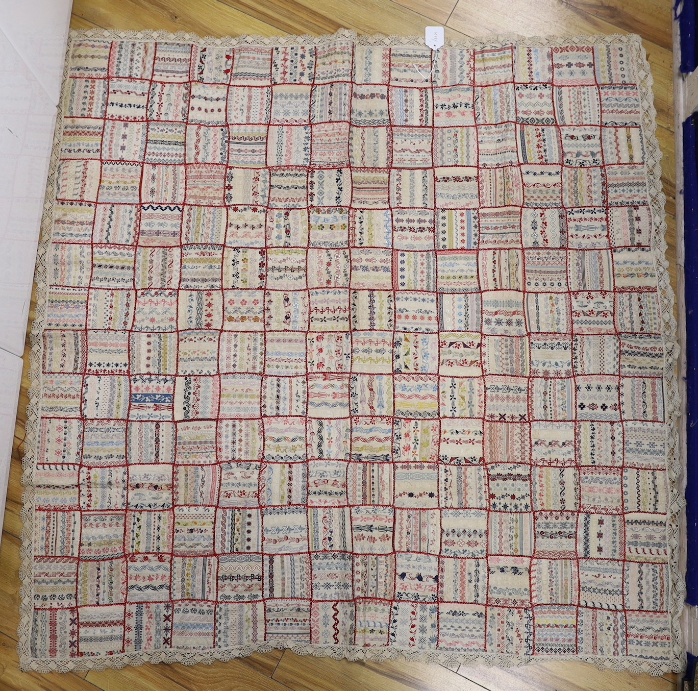 A French early 20th century ribbon patchwork cover with lace trimmimg